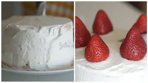 Layered Strawberry Cream Cake Garnished with Fresh Strawberries