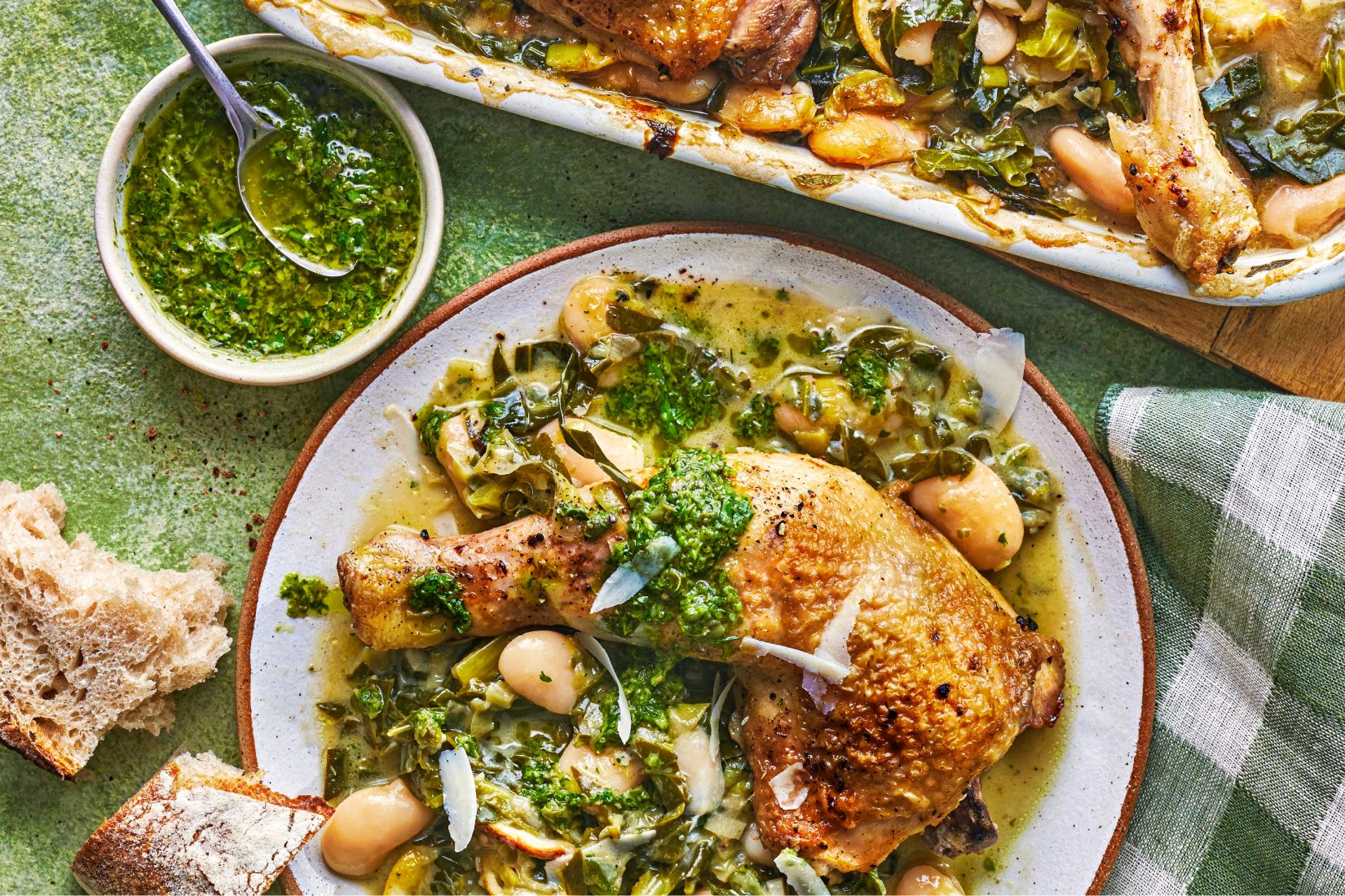 A vibrant spring dish featuring fresh asparagus spears and a creamy sauce in a rustic pan.