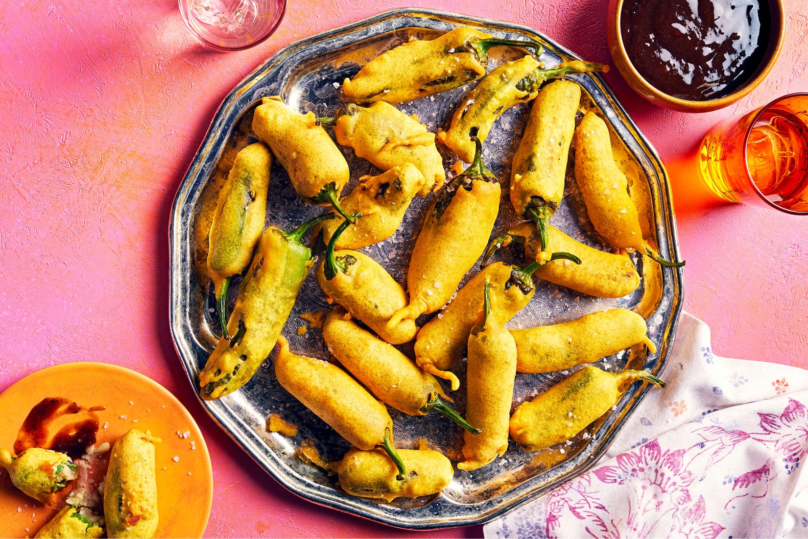 A colourful spread of traditional Indian snacks for celebrating the Holi festival, including dosa and chana chaat.