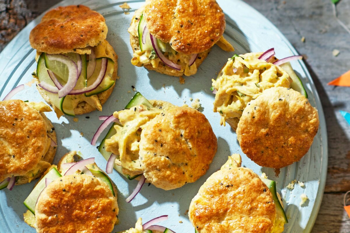 Scones split and filled with creamy coronation chicken salad.