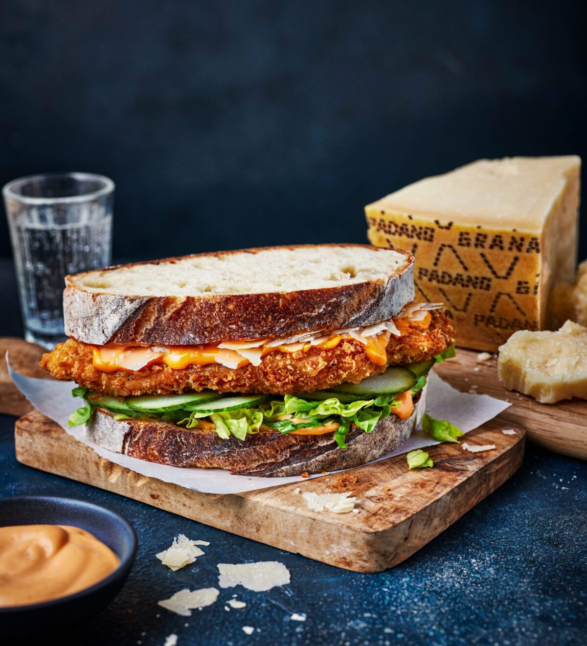 A crispy schnitzel sandwich with a cheesy crust.