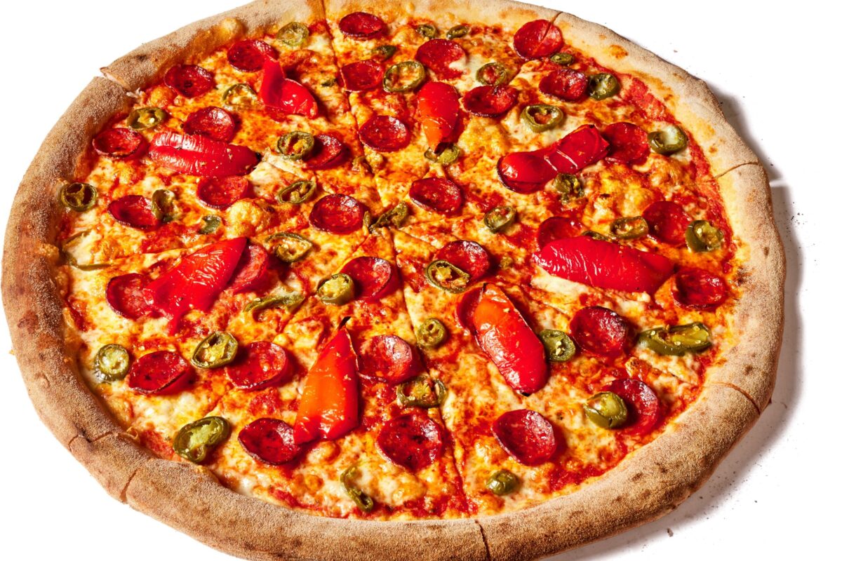 A delicious, cheesy slice of finished New York-style pizza.