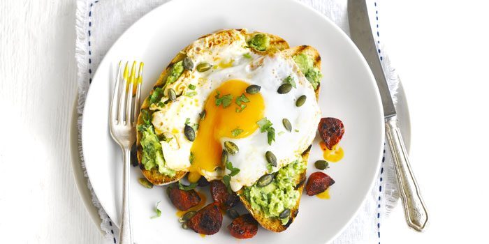 A perfectly cooked fried egg on avocado toast