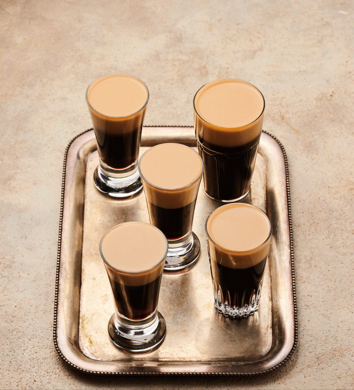 Baby Guinness shots that look like miniature pints.