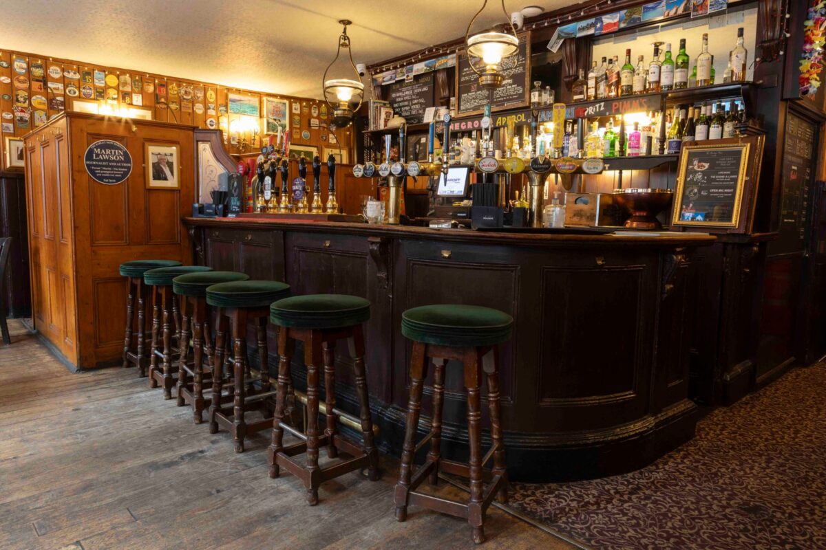 The cozy interior bar of The Barley Mow pub
