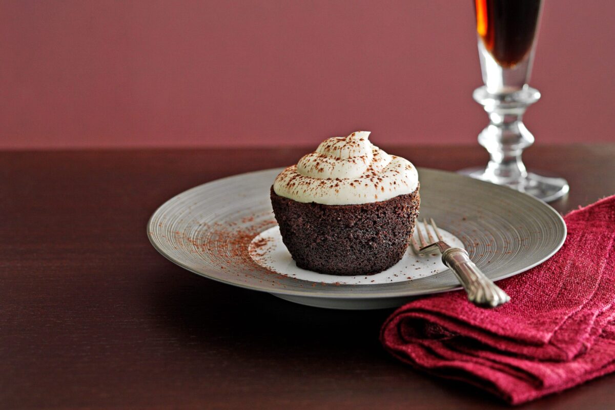 A single Chocolate Guinness cupcake on a plate.