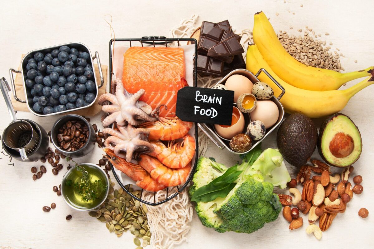 A collection of brain-healthy foods like berries, nuts, and leafy greens.