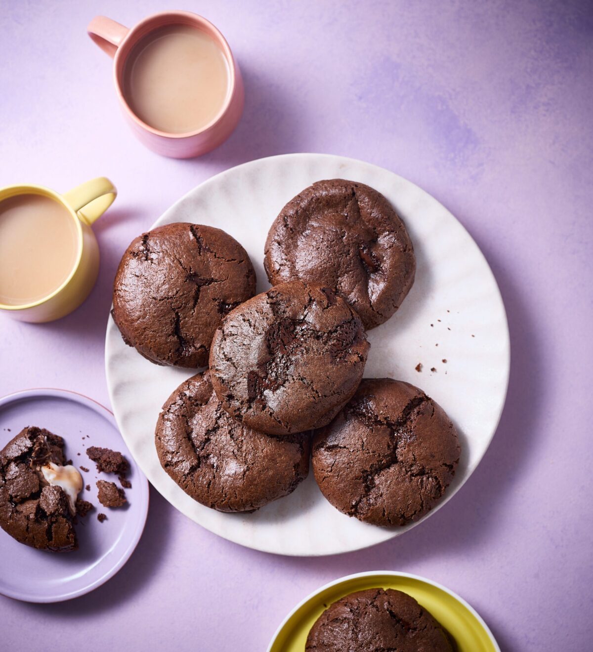 Chocolate cookies with a gooey Creme Egg centre on a plate