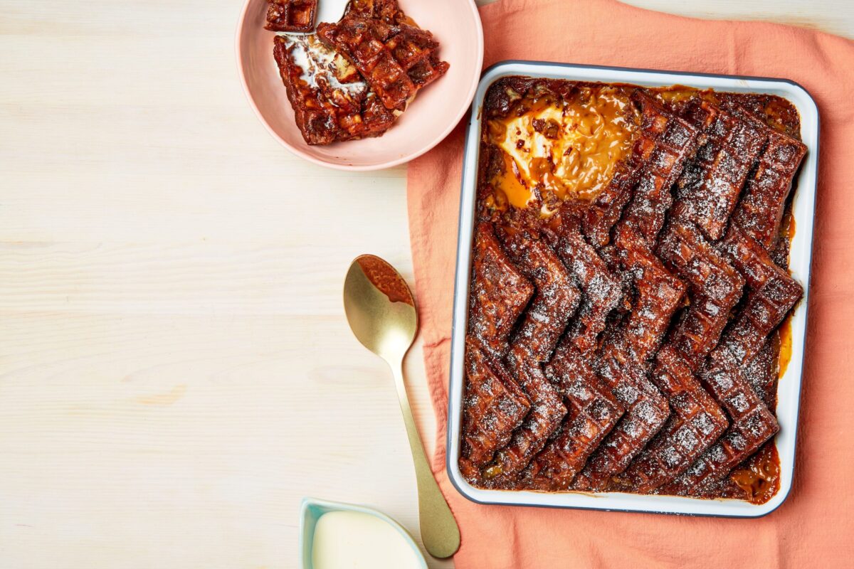 A rich chocolate and salted caramel waffle pudding in a baking dish.