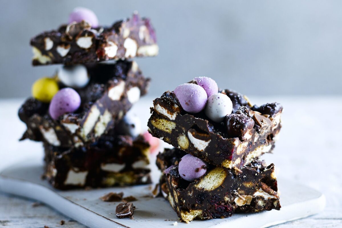 Squares of Easter egg rocky road filled with marshmallows and topped with mini eggs