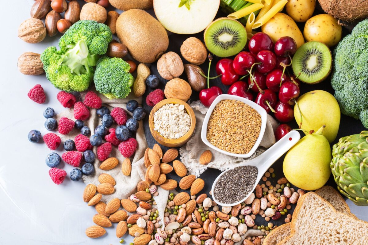 A colourful assortment of high-fibre foods including fruits, vegetables, and grains.