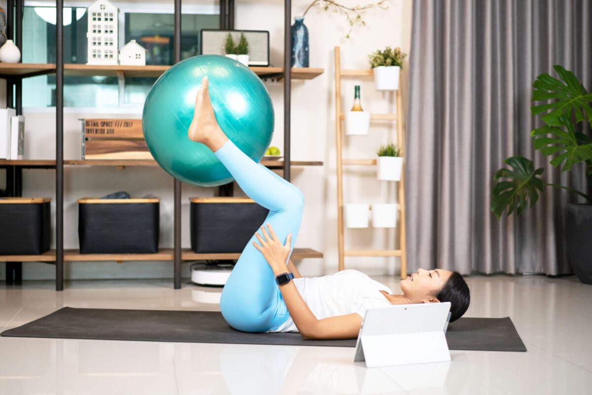 Woman using a medicine ball for core exercises