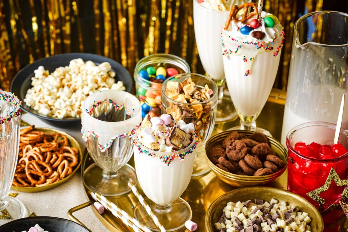 A delicious vanilla milkshake with whipped cream and a straw