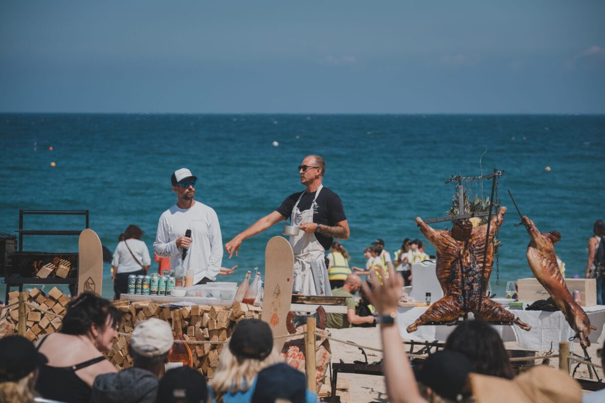 Chefs cooking on a barbecue on the beach at the St Ives Food Festival