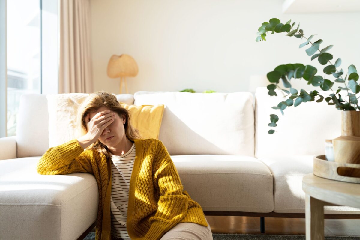 A person looking tired, illustrating a common symptom of magnesium deficiency.