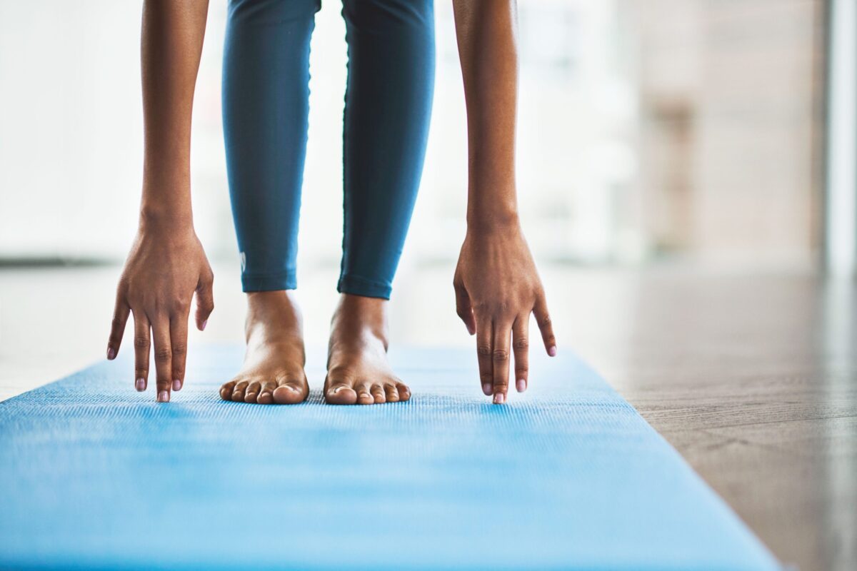 Person performing a toe touch stretch.