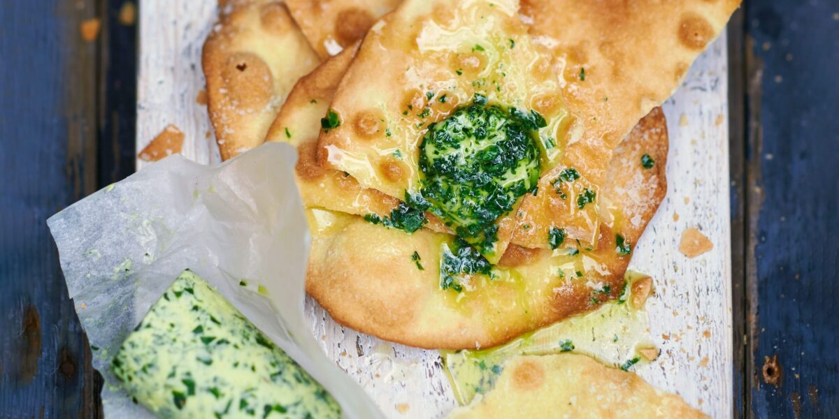 A slice of bread topped with melting wild garlic butter.