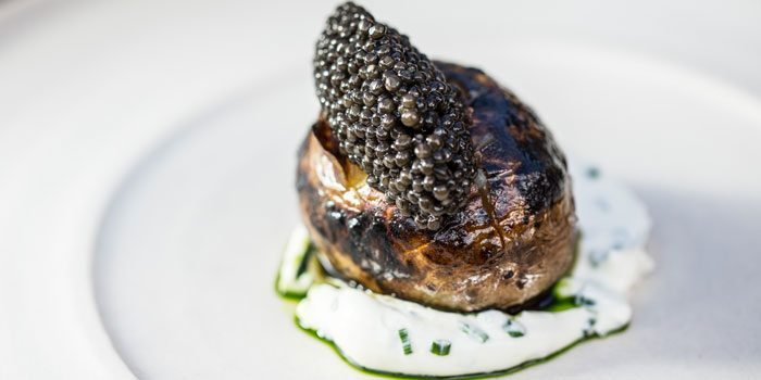 A dish garnished with expensive caviar.