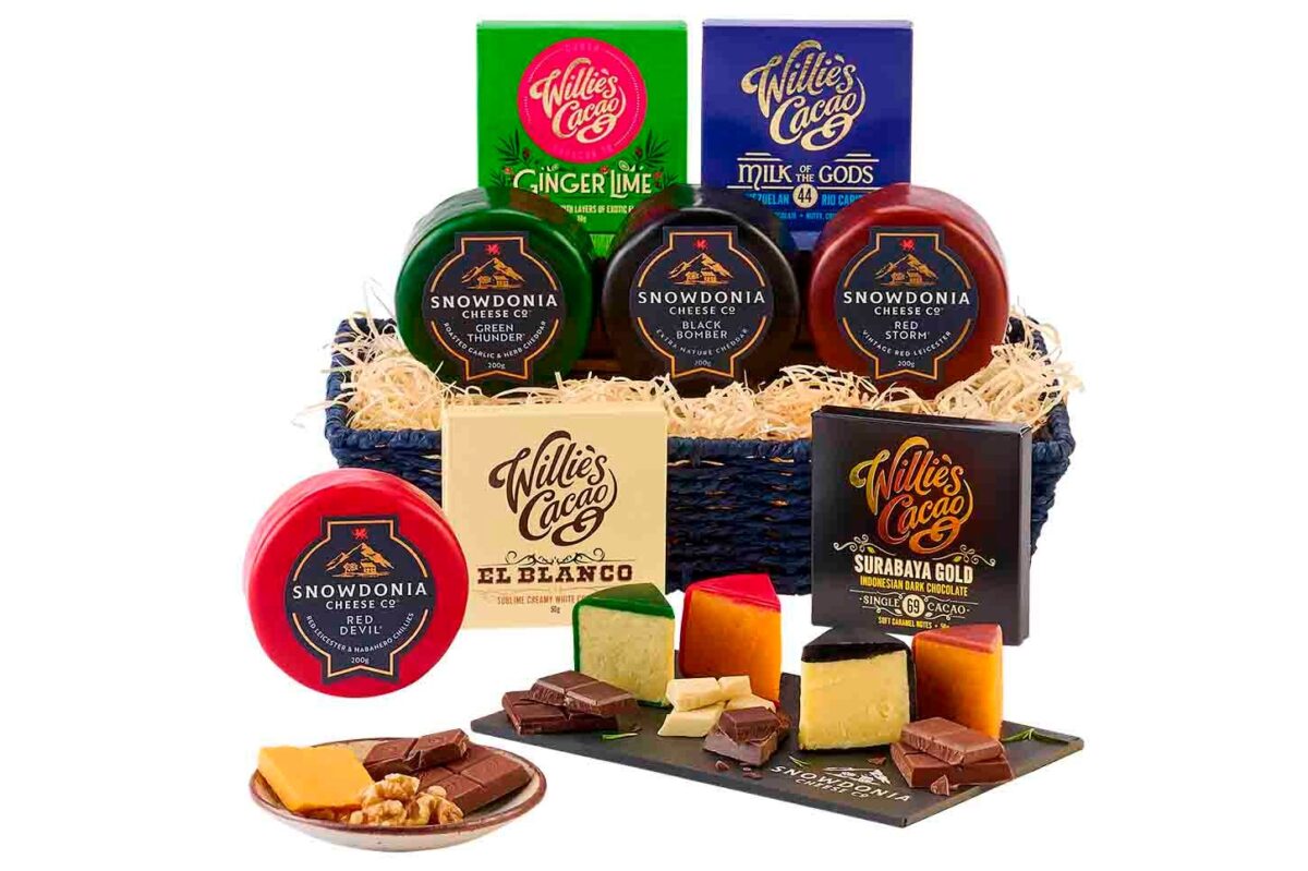 A gift basket with cheese and chocolate.