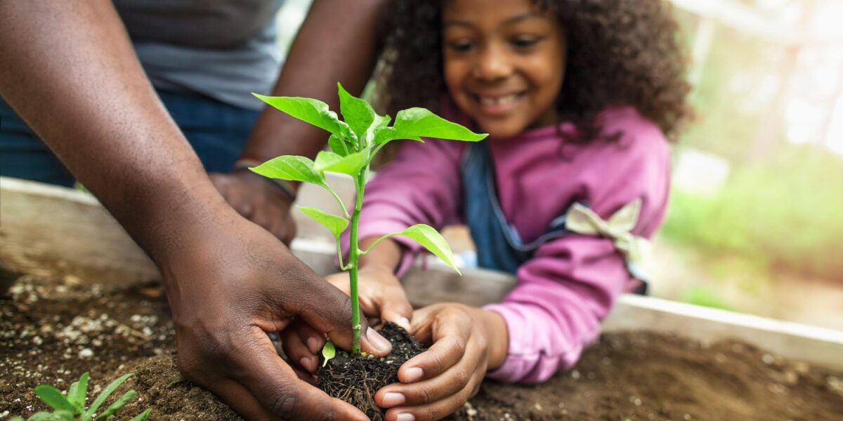 Children gardening and planting together