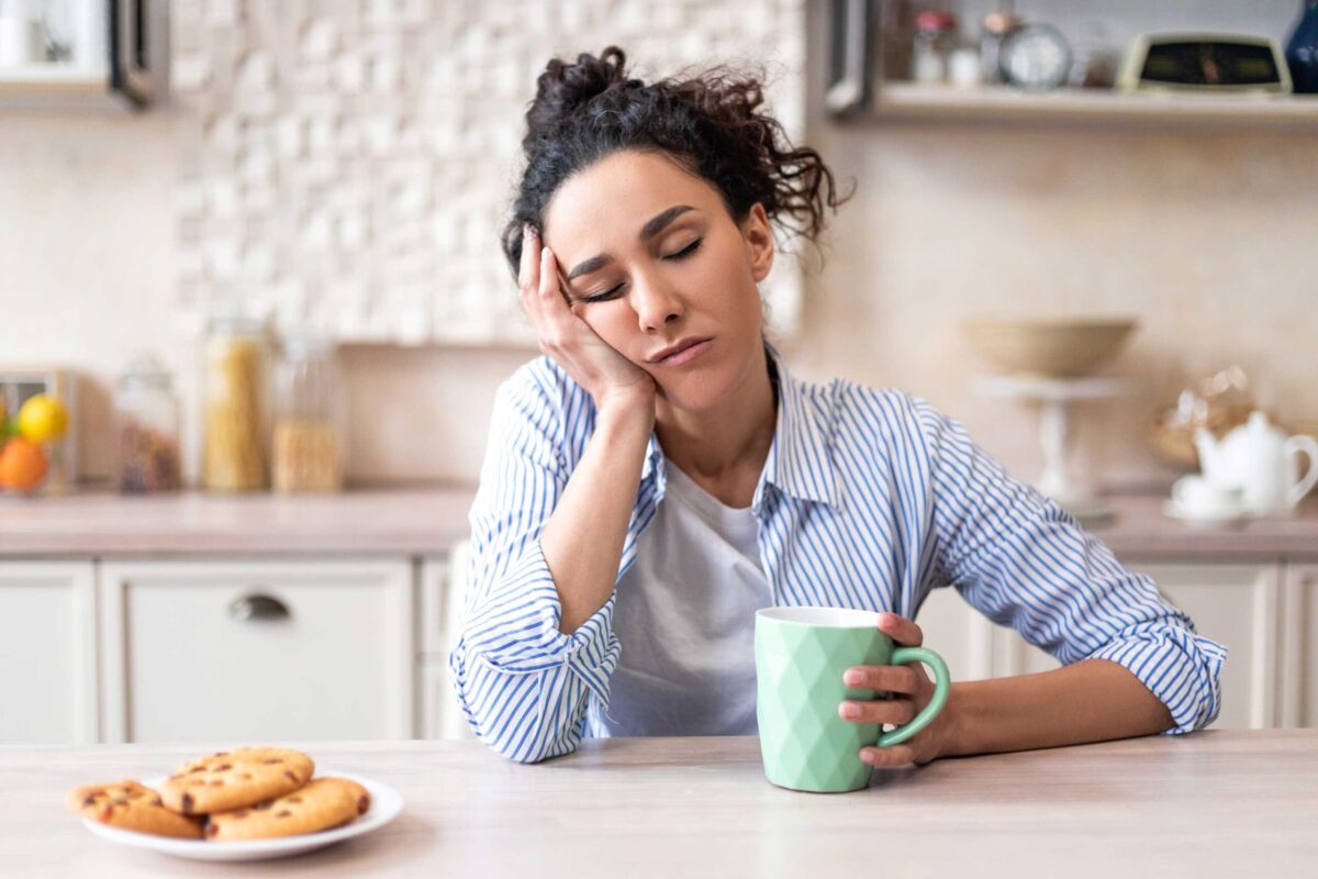A woman sleeping peacefully on a comfortable bed.