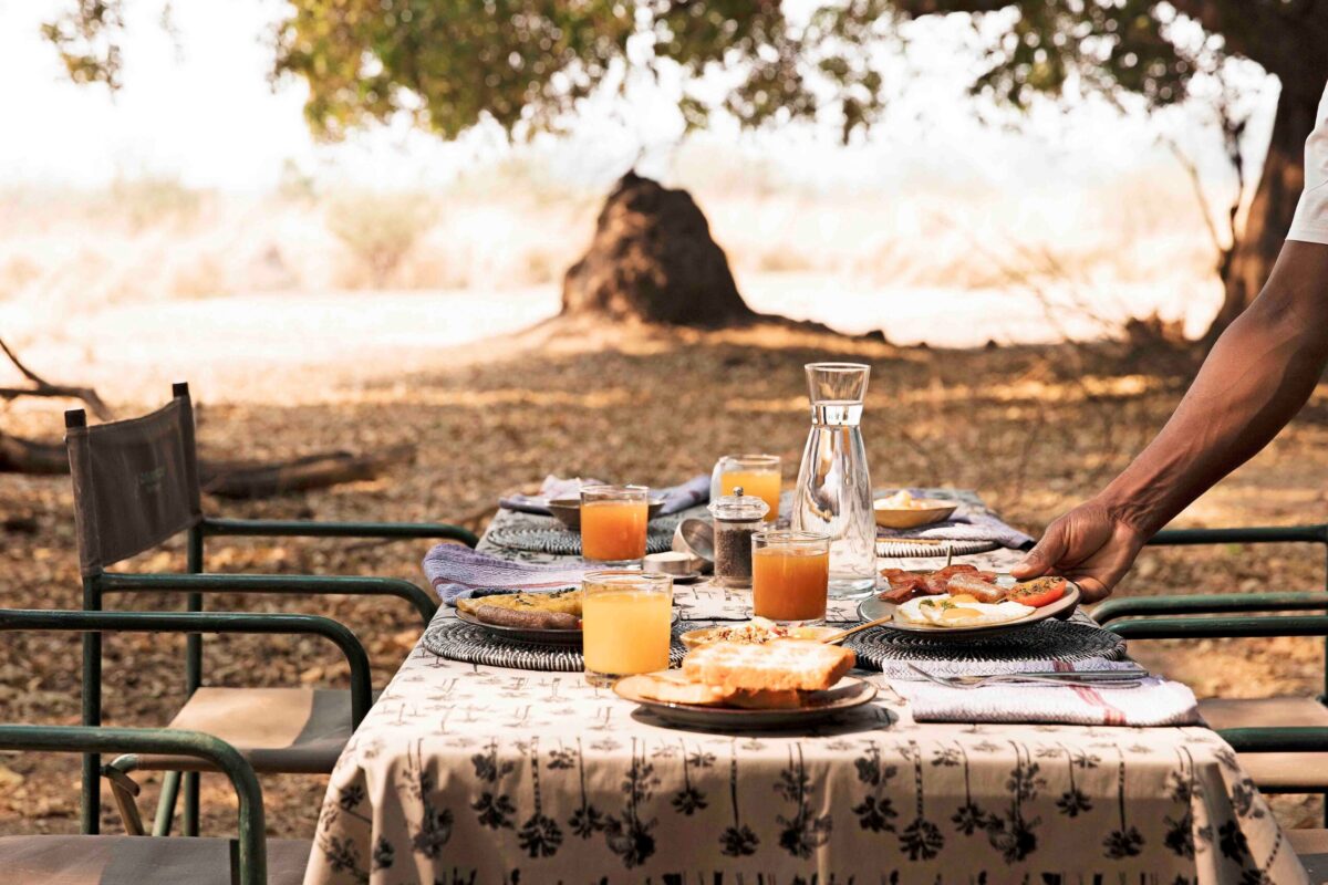 A beautiful brunch spread outdoors on a wooden table