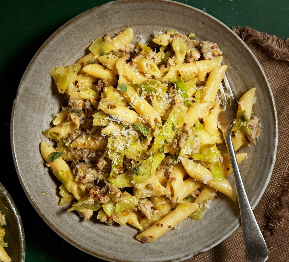 Charred Hispi Cabbage & Sausage Pasta served in a dish