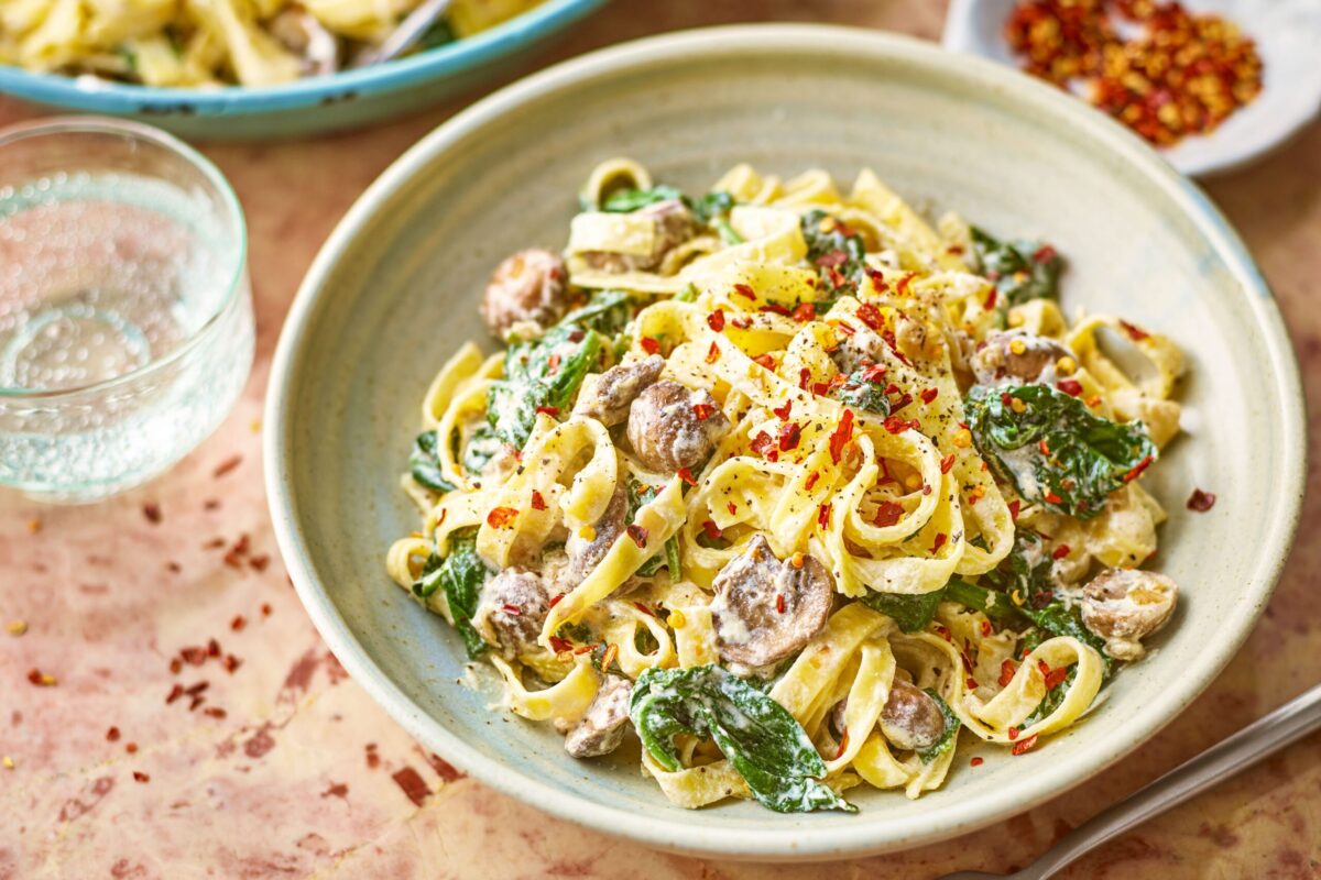 Creamy Mushroom & Spinach Pasta in a beige bowl