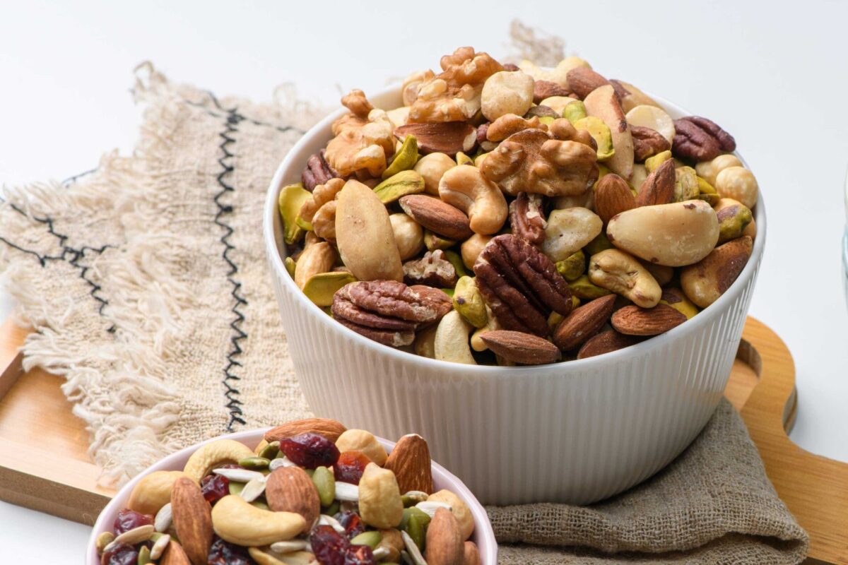 A bowl of mixed nuts including walnuts and almonds